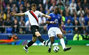 Images Dated 7th May 2011: Distin vs Dzeko: Everton vs Manchester City Clash at Goodison Park (07 May 2011)