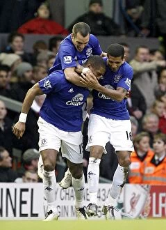 Images Dated 16th January 2011: Distin's Stunner: Thrilling Opener - Everton's Victory Kickoff vs. Liverpool (16 January 2011)