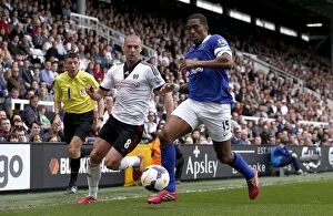 Images Dated 30th March 2014: Distin's Triumph: Everton's 3-1 Victory over Fulham (30-03-2014) - Distin vs. Kasami
