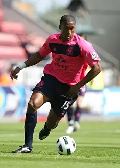 30 April 2011 Wigan Athletic V Everton Prints: Distin's Unyielding Spirit: Everton's Battle Against Wigan Athletic (30 April 2011)