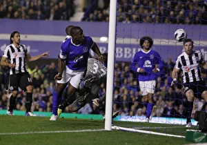 Everton 2 V Newcastle United 2 : Goodison Park : 17-09-2012 Prints: Dramatic Last-Minute Header Clearance: Anichebe vs. Williamson at Goodison Park