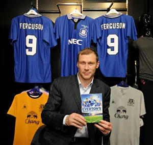 Player Feature Prints: Duncan Ferguson poses with a copy of Evertons Greatest Premier League XI DVD in the Everton Two Store at Liverpool One