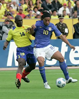 Ecuadors Castillo fights for the ball Brazils Ronaldinho during their World Cup qualifier soccer match in Quito