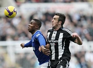 Images Dated 22nd February 2009: Enrique vs Anichebe: Intense Clash between Newcastle and Everton in Barclays Premier League
