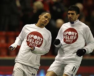 Images Dated 13th March 2012: Everton FC at Anfield: Pienaar and Stracqualursi Warm Up Before Liverpool Clash (BPL 2012)