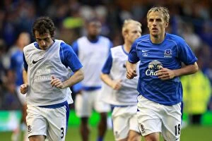 Images Dated 29th August 2012: Everton FC: Baines and Neville in Focus during Pre-Match Training before Capital One Cup Clash vs