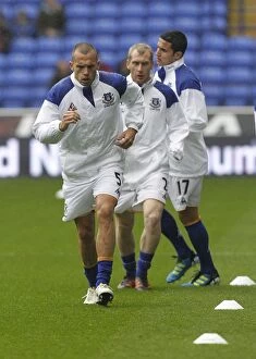Images Dated 26th November 2011: Everton FC: Johnny Heitinga's Intense Focus During Pre-Match Warm-Up at Reebok Stadium