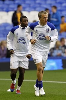 Images Dated 31st March 2012: Everton FC: Neville and Gueye Warming Up Before Everton vs West Bromwich Albion (31 March 2012)