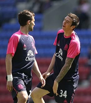 Images Dated 30th April 2011: Everton FC: Vellios and Duffy Focused during Premier League Warm-up at Wigan Athletic