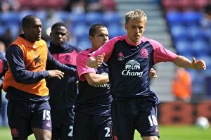 Images Dated 30th April 2011: Everton Football Club: Phil Neville and Team Warm Up Before Wigan Athletic Clash