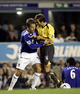 Images Dated 8th November 2006: Everton v Arsenal Carling Cup Fourth Round Phil Neville and Arsenals Mathieu Flamini clash
