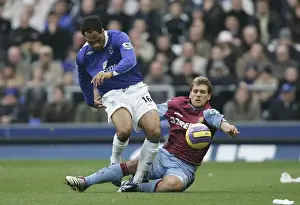 Joleon Lescott Prints: Everton v Aston Villa - Evertons Joleon Lescott and Aston Villas Stilian Petrov