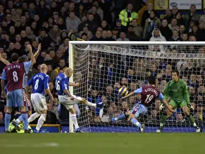 Everton v Aston Villa Lee Carsley - Everton shoots at goal under pressure from Liam Ridgewell