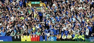 Images Dated 20th September 2009: Everton vs Blackburn Rovers: Everton Fans Protect Their Eyes from the Scorching Goodison Park Sun
