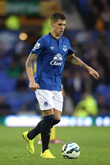 Full Length Prints: Everton vs Chelsea: Muhamed Besic at Goodison Park - Barclays Premier League Showdown