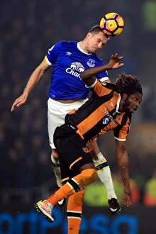 Images Dated 30th December 2016: Everton vs Hull City: Jagielka vs Mbokani - Aerial Battle in the Premier League