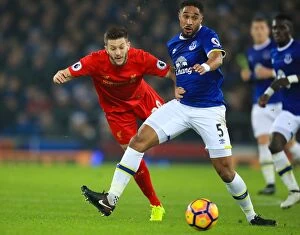 Images Dated 19th December 2016: Everton vs Liverpool: A Battle for the Ball - Lallana vs Williams at Goodison Park