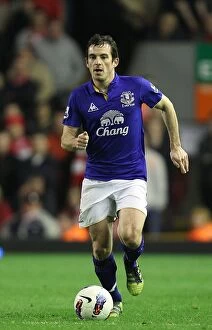 Images Dated 13th March 2012: Everton vs. Liverpool Rivalry: Leighton Baines' Epic Showdown at Anfield (March 13, 2012)