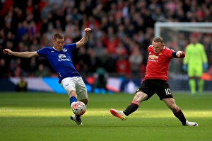 Emirates FA Cup - Semi-Final - Everton V Manchester United - Wembley Stadium Prints: Everton vs Manchester United: McCarthy vs Rooney - Emirates FA Cup Semi-Final Battle at Wembley Stadium