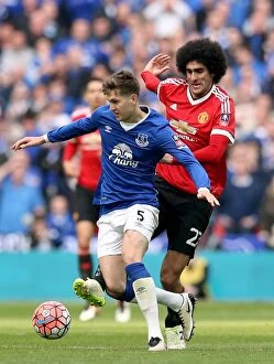 Images Dated 23rd April 2016: Everton vs Manchester United: A Battle for the FA Cup Semi-Final Ball - Fellaini vs Stones at