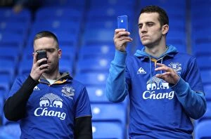 Images Dated 29th October 2011: Everton vs Manchester United: Fans Capturing the Action at Goodison Park (2011)