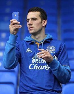 Images Dated 29th October 2011: Everton vs Manchester United: A Fan's Passionate Snapshot from Goodison Park (2011)