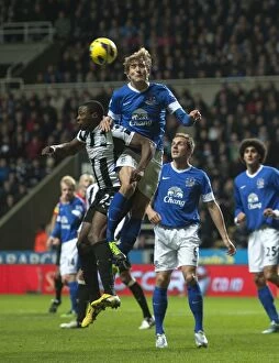 Newcastle United 1 v Everton 2 : St. James' Park : 02-01-2013 Collection: Everton's Air Battle: Ameobi vs. Jelavic in the Intense Clash at St