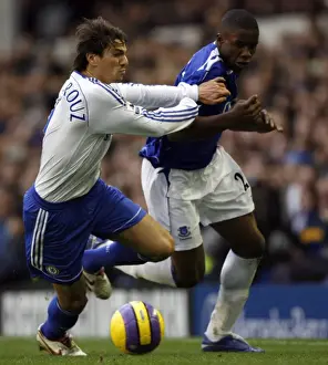 Evertons Anichebe is held back by Chelseas Boulahrouz during their English Premier League soccer m