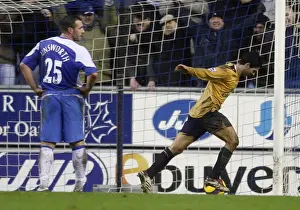Evertons Arteta celebrates after scoring as Wigan Athletics Unsworth looks on during their English