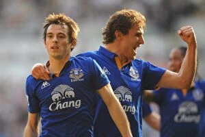 24 March 2012 v Swansea City, Liberty Stadium Collection: Everton's Baines and Jelavic: Celebrating Their First Goal Together Against Swansea City