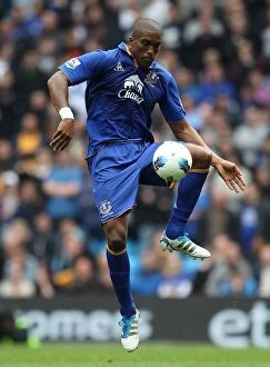 Images Dated 24th September 2011: Everton's Battle at Etihad Stadium: Sylvain Distin Stands Firm Against Manchester City
