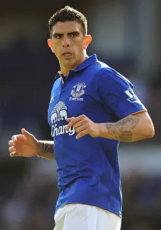 Everton's Denis Stracqualursi in Action: Premier League Clash Against Wigan Athletic (September 17, 2011)