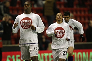 13 March 2012 V Liverpool, Anfield Prints: Everton's Distin and Pienaar Gear Up for Premier League Showdown Against Liverpool