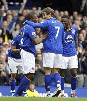 Images Dated 31st March 2012: Everton's Double Trouble: Anichebe and Jelavic Celebrate Goals Against West Bromwich Albion