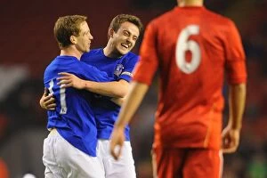 Images Dated 24th March 2011: Everton's Forshaw and Baxter: A Moment of Triumph in the Derby Match vs