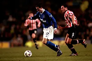 Framed Print : Everton's Francis Jeffers Slips Past Exeter City's Chris Curran in FA Cup Third Round Replay Thriller Framed Print : Everton's Francis Jeffers Slips Past Exeter City's Chris Curran in FA Cup Third Round Replay Thriller