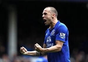 09 April 2012 v Sunderland, Goodison Park Collection: Everton's Glorious Four: Heitinga and Anichebe Celebrate Victory with Four Goals Against