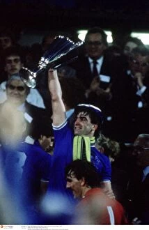 European Cup Winners Cup - 1985 Collection: Everton's Glory: Kevin Ratcliffe Lifts the European Cup Winners Cup - Everton vs Rapid Vienna, 1985
