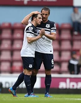 Images Dated 21st September 2013: Everton's Glory: Leighton Baines and Phil Jagielka Celebrate a Thrilling 3-2 Victory over West Ham