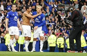 Images Dated 17th October 2010: Everton's Glory: Tim Cahill and Phil Neville's Derby Victory Celebration at Goodison Park