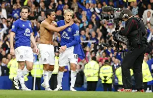 Everton's Glory: Tim Cahill and Phil Neville's Derby Victory Celebration at Goodison Park
