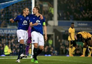 Images Dated 6th November 2014: Everton's Jagielka and Osman: Double Strike Celebration in Europa League Victory over Lille