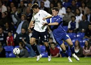 James Beattie Collection: Evertons James Beattie and Peterbroughs Mark Arber in action