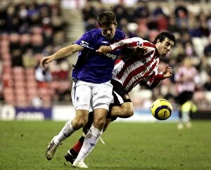 Images Dated 31st December 2005: Everton's James Beattie vs. Sunderland's Julio Arca: A Football Rivalry