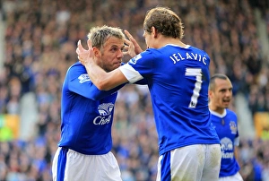 Everton 3 V Southampton 1 : Goodison Park : 29-09-2012 Prints: Everton's Jelavic and Neville: A Celebratory Moment as Everton Takes a 3-1 Lead over Southampton (September 29)