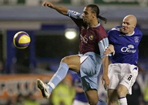Everton v West Ham United Collection: Evertons Johnson challenges West Ham Uniteds Ferdinand for the ball during their English Premier L
