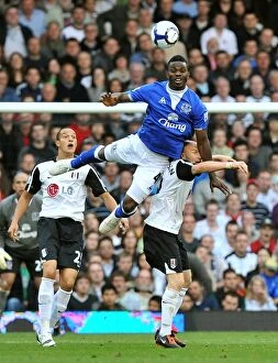 Images Dated 13th September 2009: Everton's Joseph Yobo vs. Fulham's Andrew Johnson: Aerial Battle in the Premier League