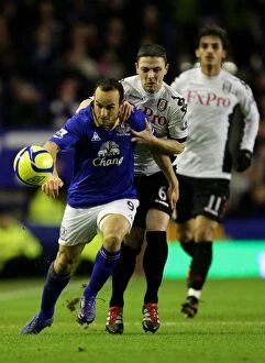 FA Cup - Round 4 - Everton v Fulham - 27 January 2012 Collection: Everton's Landon Donovan Slips Past Chris Baird in FA Cup Showdown at Goodison Park