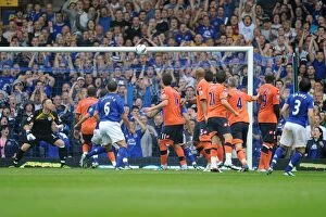 Images Dated 20th August 2011: Everton's Leighton Baines Stuns with a Free-Kick Hit off the Bar vs. Queens Park Rangers (2011)