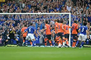 Everton's Leighton Baines Stuns with a Free-Kick Hit off the Bar vs. Queens Park Rangers (2011, Barclays Premier League)